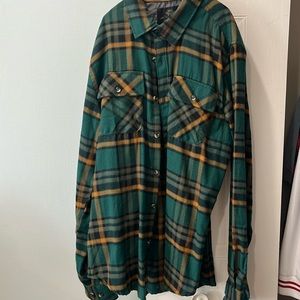 Green and yellow checkered sweater